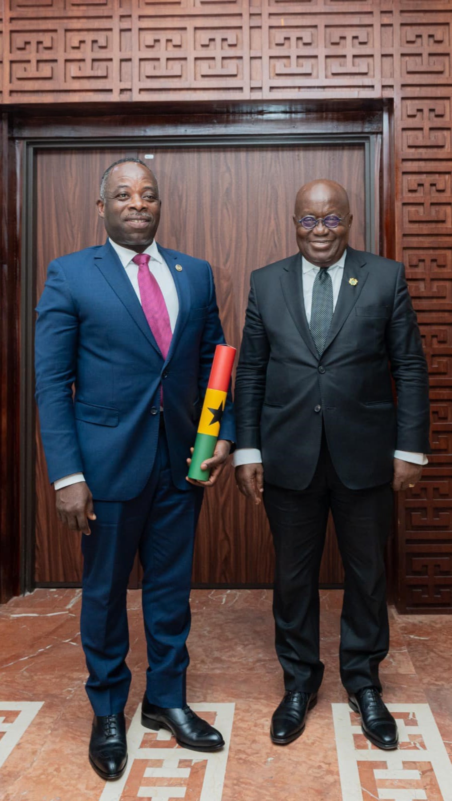 Head of OHCS and the president of Ghana.